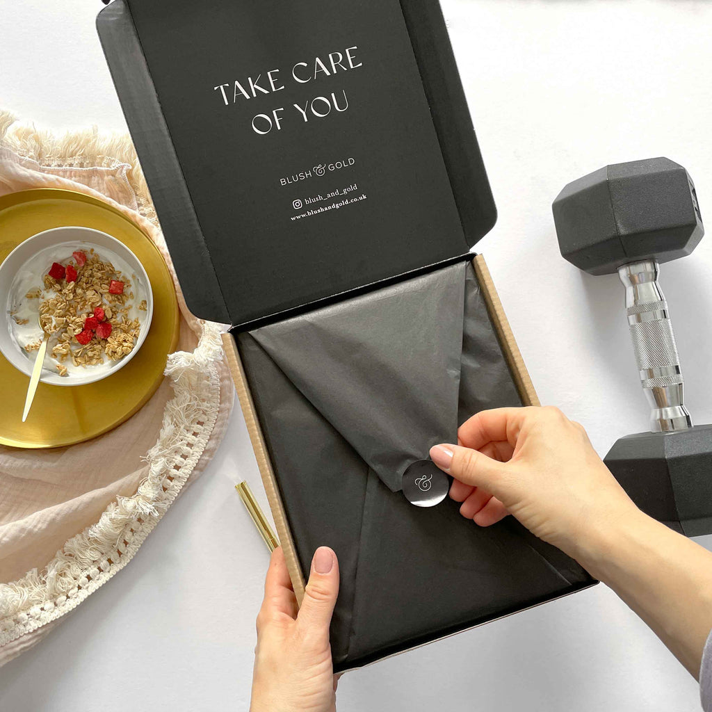 Person opening a black box with 'Take Care of You' text