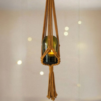 Glass candleholder in macrame hanger
