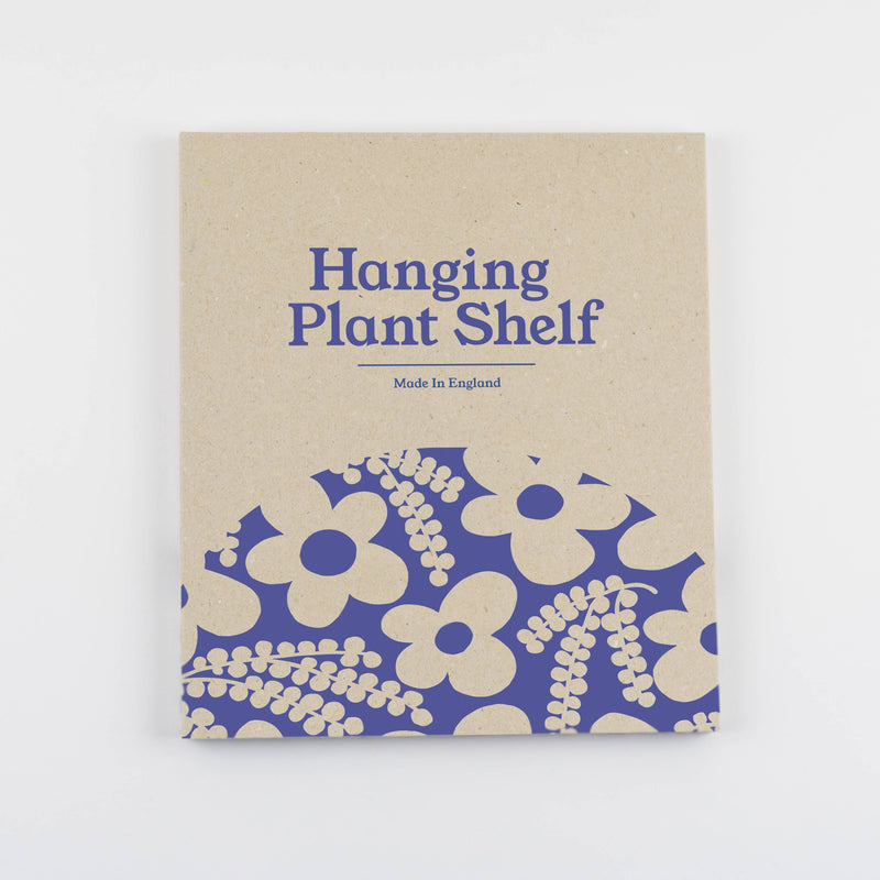Hanging plant shelf packaging with blue floral design and text on a beige background